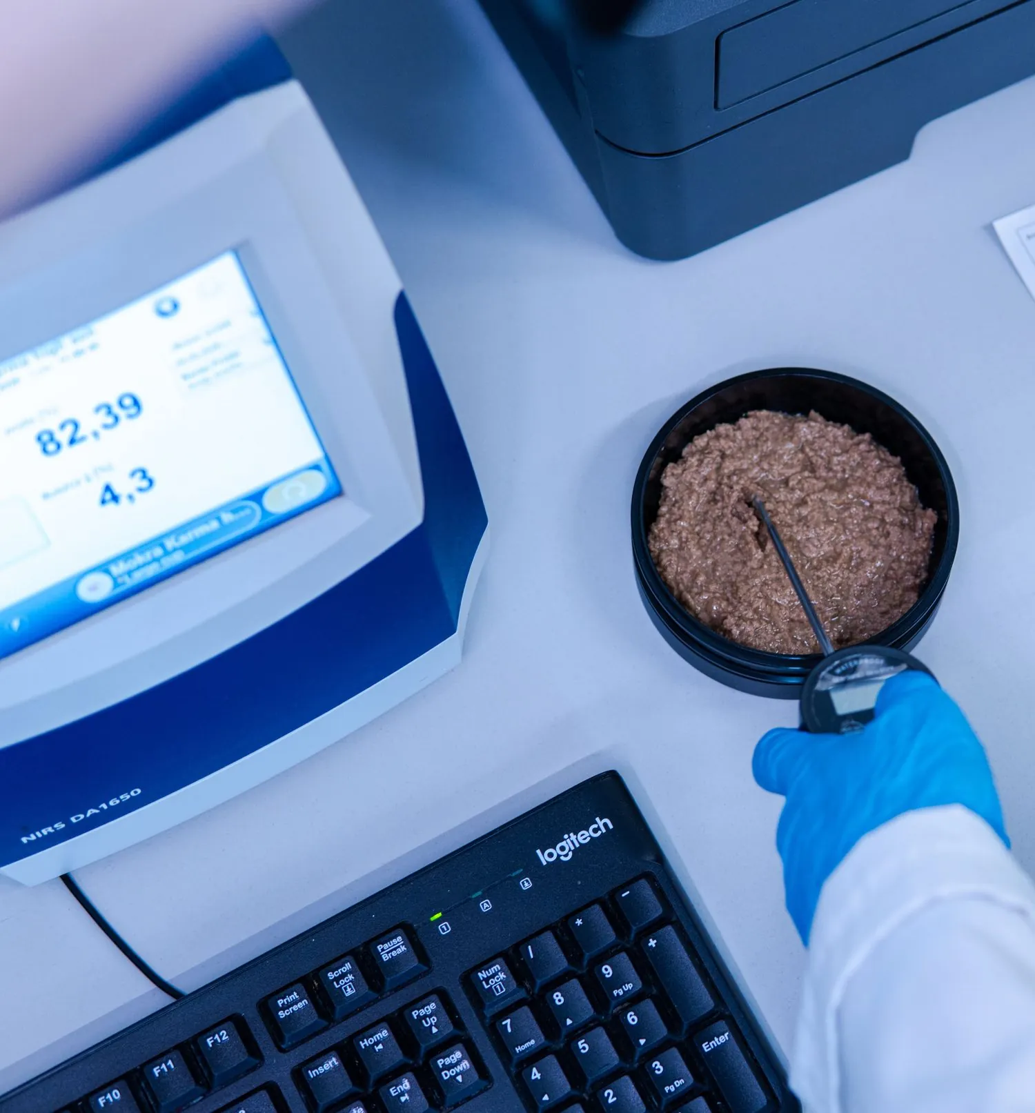 Quality control laboratory with scientist analyzing samples
